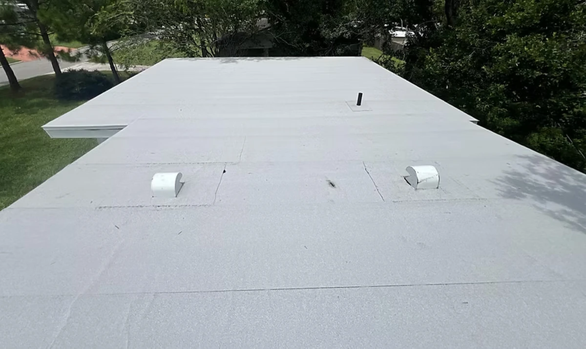 White flat low-slope roof system on a Davenport, Florida property